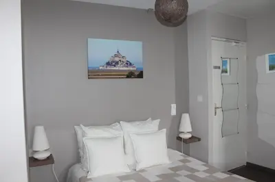Un ou plusieurs lits dans un hébergement de l'établissement Aux Chambres du Mont
