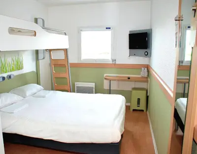 Un ou plusieurs lits dans un hébergement de l'établissement ibis budget Flers Grands Champs