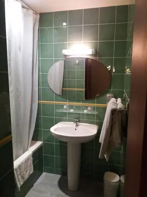 Salle de bains dans l'établissement L'Ecailler