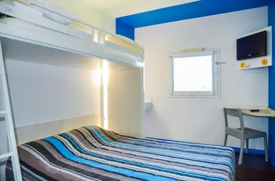 Un ou plusieurs lits dans un hébergement de l'établissement FYL GOOD ex hotelF1 Cherbourg