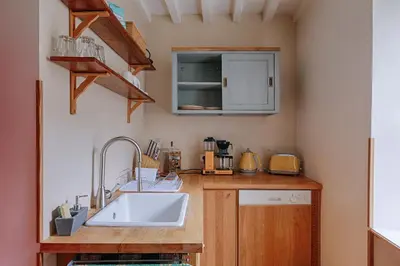 Cuisine ou kitchenette dans l'établissement Maison de ville Bayeux
