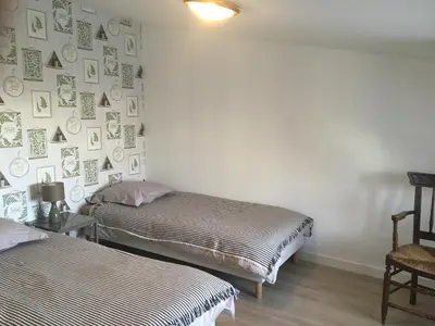 Un ou plusieurs lits dans un hébergement de l'établissement Chambre d'hôtes Logis de Saint Jean