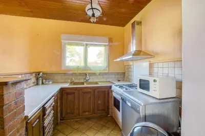 Cuisine ou kitchenette dans l'établissement Marine - Maison et jardin - Grande Plage à 150 m
