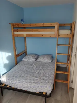 Un ou plusieurs lits dans un hébergement de l'établissement Appartement F3 Cabourg près plage hippodrome centre-ville