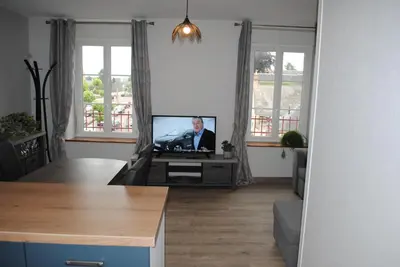 Télévision ou salle de divertissement dans l'établissement Gite Le Jour J