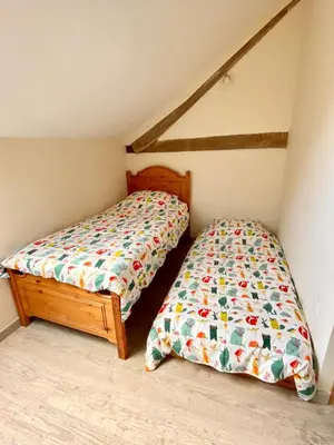 Un ou plusieurs lits dans un hébergement de l'établissement Greener Pastures - Normandy Self Catering Gites