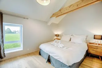 Un ou plusieurs lits dans un hébergement de l'établissement Suite & Spa Maison de charmes avec Sauna & Hammam