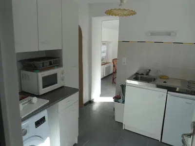 Cuisine ou kitchenette dans l'établissement LA VUULE MAISON