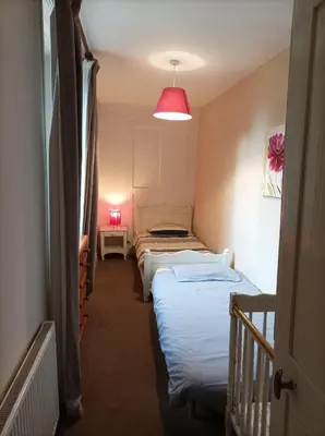 Un ou plusieurs lits dans un hébergement de l'établissement La Petellerie, maison de campagne avec piscine pour un séjour détente