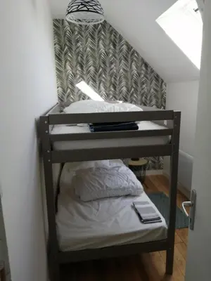 Un ou plusieurs lits dans un hébergement de l'établissement LE BELLEVUE 47 gîte touristique 3 étoiles