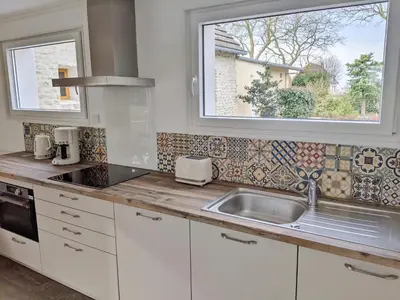 Cuisine ou kitchenette dans l'établissement Maison Blanche en Côte de Nacre