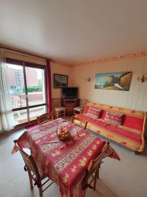 Coin salon dans l'établissement Apt At 2 Steps From The Beach And Proust Promenade