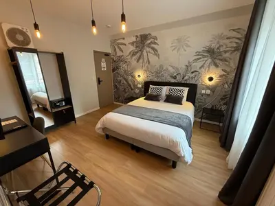 Un ou plusieurs lits dans un hébergement de l'établissement OXXOTEL & Spa