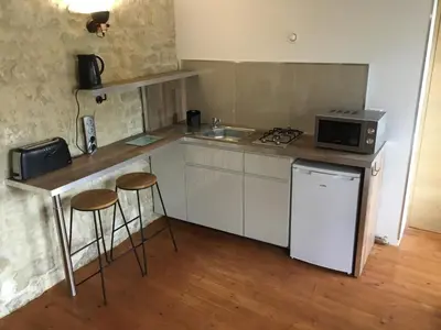Cuisine ou kitchenette dans l'établissement Le Delax