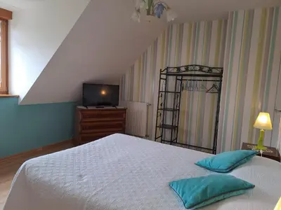Un ou plusieurs lits dans un hébergement de l'établissement Chambres d'hôtes La Rive - Le Mont Saint Michel