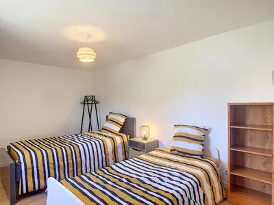 Un ou plusieurs lits dans un hébergement de l'établissement Maison 6 pers proche centre ville