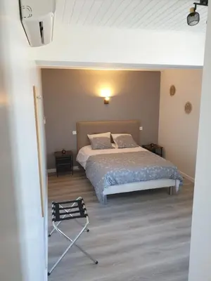 Un ou plusieurs lits dans un hébergement de l'établissement Chambres de Villée