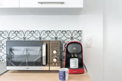 Cuisine ou kitchenette dans l'établissement Le Coco de Cancale - Duplex proche mer