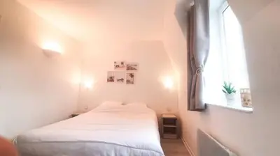 Un ou plusieurs lits dans un hébergement de l'établissement Appartement avec piscine, 100m plage et hypercentre