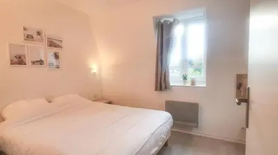 Un ou plusieurs lits dans un hébergement de l'établissement Appartement avec piscine, 100m plage et hypercentre