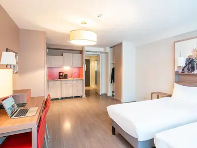 Un ou plusieurs lits dans un hébergement de l'établissement B&B HOME Caen Centre Gare
