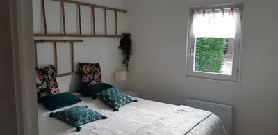 Un ou plusieurs lits dans un hébergement de l'établissement Le CHALET FLEURI