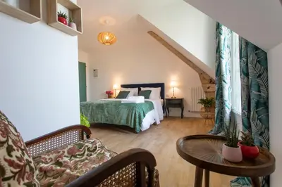 Un ou plusieurs lits dans un hébergement de l'établissement La Bellevue Bréville - B&B