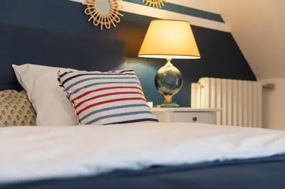 Un ou plusieurs lits dans un hébergement de l'établissement La Bellevue Bréville - B&B