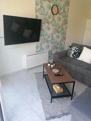 Télévision ou salle de divertissement dans l'établissement Gîte L'âme Du Gourmand