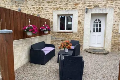 Coin salon dans l'établissement Gîte du Bois Pennier, au calme , à 15 km des plages du Débarquement