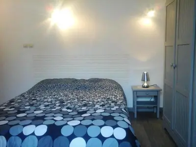 Un ou plusieurs lits dans un hébergement de l'établissement Maison charmante - Pontorson + Parking