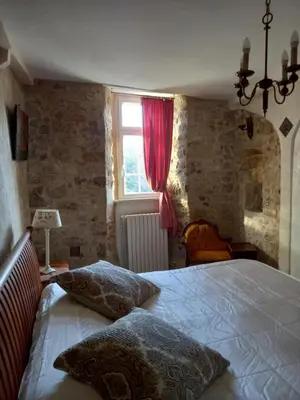Un ou plusieurs lits dans un hébergement de l'établissement Chateau Le Val