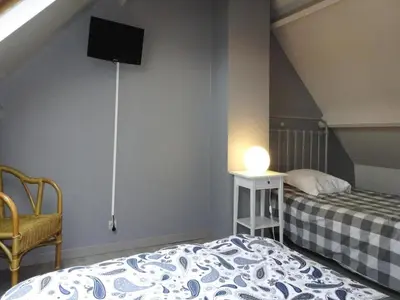 Un ou plusieurs lits dans un hébergement de l'établissement Holiday Home in Portbail near Sandy Beach
