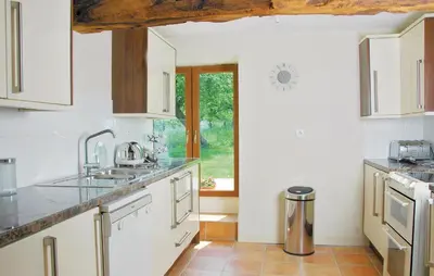 Cuisine ou kitchenette dans l'établissement Holiday Home Lieu Dit La Riviere