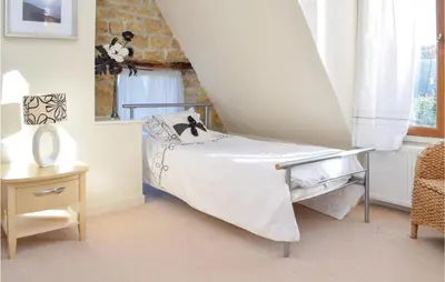Un ou plusieurs lits dans un hébergement de l'établissement Holiday Home Lieu Dit La Riviere