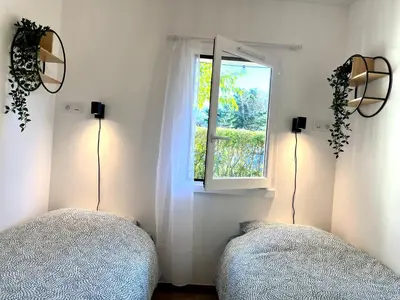 Un ou plusieurs lits dans un hébergement de l'établissement Perle Marine au pied de la plage