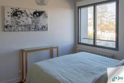 Un ou plusieurs lits dans un hébergement de l'établissement Villa Jules Petit Gîte