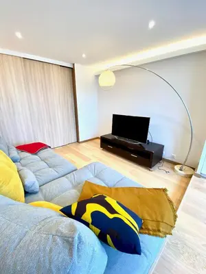 Télévision ou salle de divertissement dans l'établissement Acamar, appartement en front de mer avec parking privée