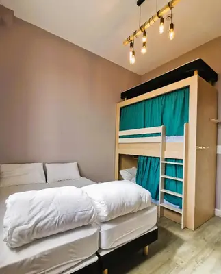 Un ou plusieurs lits dans un hébergement de l'établissement L'Etape du Mont, Family Hostel