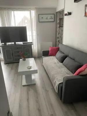 Coin salon dans l'établissement Le Pavillon - Appartement à 30 m de la plage