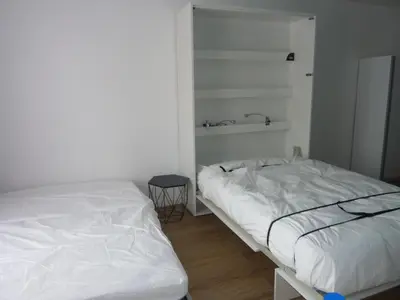 Un ou plusieurs lits dans un hébergement de l'établissement Studio bord de mer en résidence MERVILLE FRANCEVILLE PLAGE