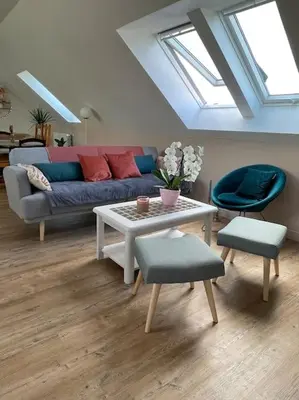 Coin salon dans l'établissement Appartement cosy sous les toits