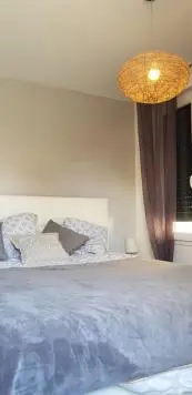 Un ou plusieurs lits dans un hébergement de l'établissement Maison moderne plein coeur de Ouistreham