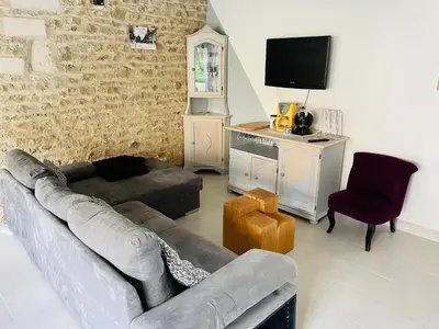 Télévision ou salle de divertissement dans l'établissement Grange à grains à l'Ombre d'une Tour