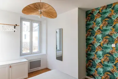 Un ou plusieurs lits dans un hébergement de l'établissement Jolie maison proche centre-ville et plages