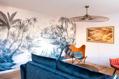 Coin salon dans l'établissement Jolie maison proche centre-ville et plages