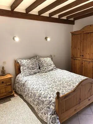 Un ou plusieurs lits dans un hébergement de l'établissement Maison traditionnelle Normande avec piscine