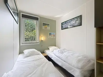 Un ou plusieurs lits dans un hébergement de l'établissement Mobil-home Grand Confort à 200m de la plage, 4 pers, piscine chauffée, parking, Wi-Fi inclus - FR-1-361A-8