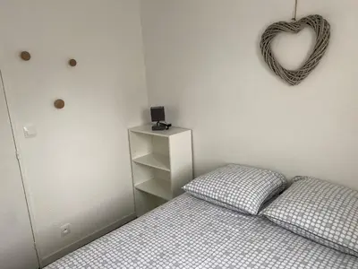 Un ou plusieurs lits dans un hébergement de l'établissement Cabourg T2 cosy avec accès direct plage