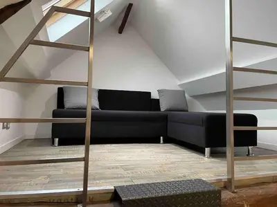 Coin salon dans l'établissement Ambre, bel appartement proche plage du débarquement